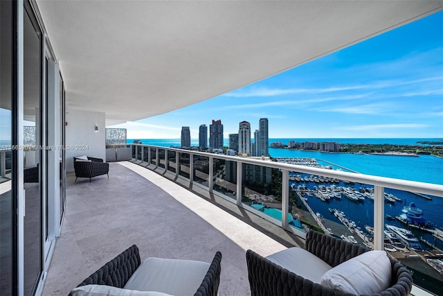 balcony featuring a water view