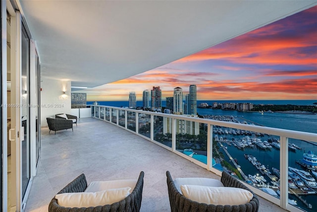 balcony at dusk with a water view