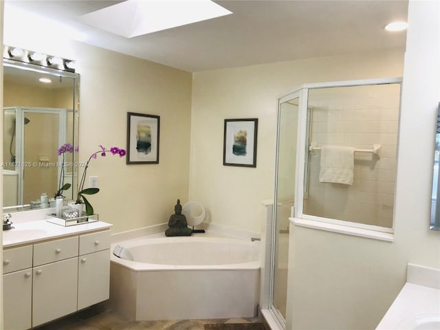 bathroom with independent shower and bath and vanity