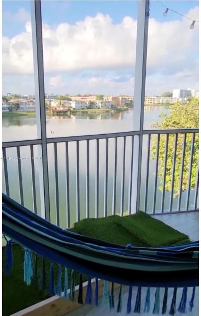 balcony featuring a water view