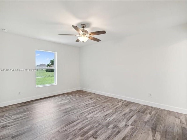 unfurnished room with wood-type flooring and ceiling fan