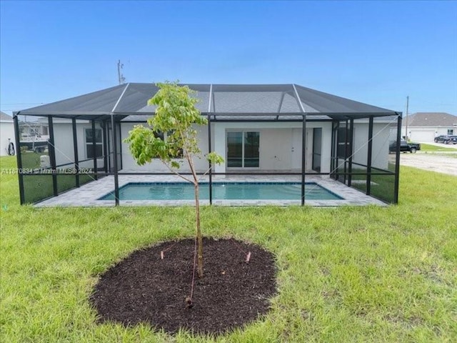 back of house with glass enclosure, a lawn, and a patio area