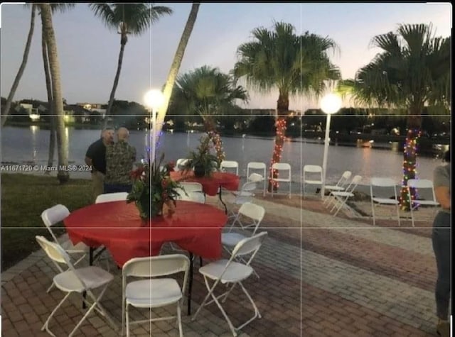 patio terrace at dusk with a water view