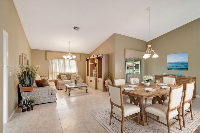 dining area featuring light tile patterned flooring, vaulted ceiling, and a chandelier