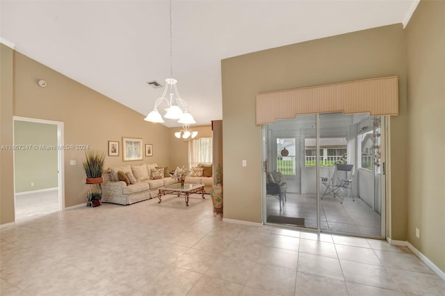 living room with light tile patterned floors, a chandelier, and high vaulted ceiling