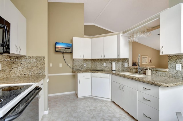 kitchen featuring sink, vaulted ceiling, white cabinetry, backsplash, and white dishwasher