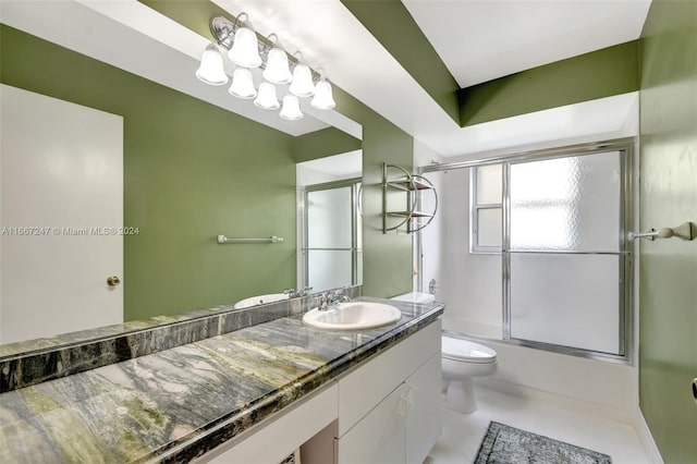 full bathroom featuring shower / bath combination with glass door, vanity, and toilet