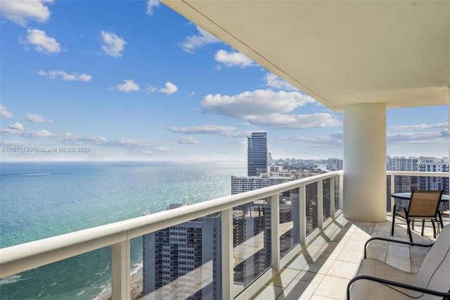 balcony featuring a water view