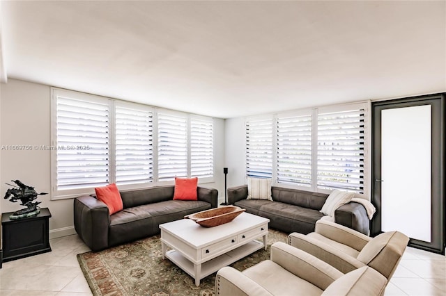 1586 S Ocean Ln Unit 125, Fort Lauderdale, FL 33316 - living room with light tile patterned floors and baseboards