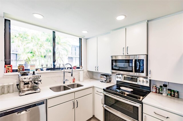 1586 S Ocean Ln Unit 125, Fort Lauderdale, FL 33316 - kitchen with a sink, light countertops, and stainless steel appliances