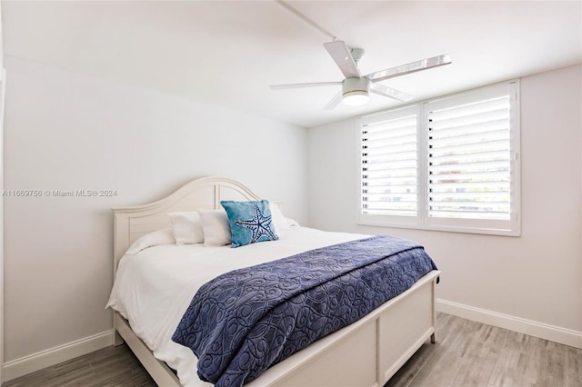 bedroom featuring light hardwood / wood-style flooring and ceiling fan