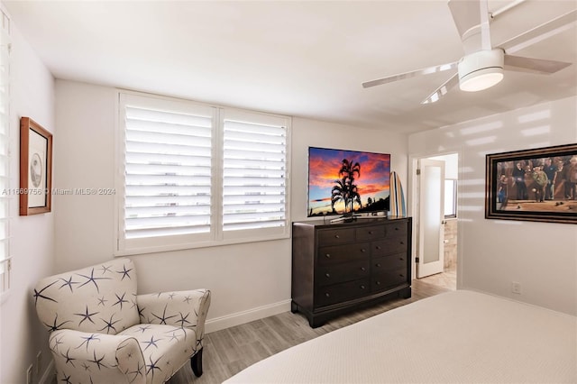 bedroom with ceiling fan and light wood-type flooring