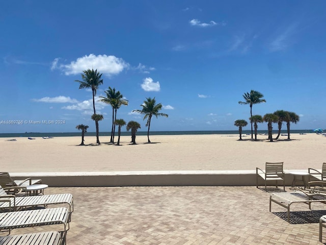 view of home's community featuring a view of the beach and a water view