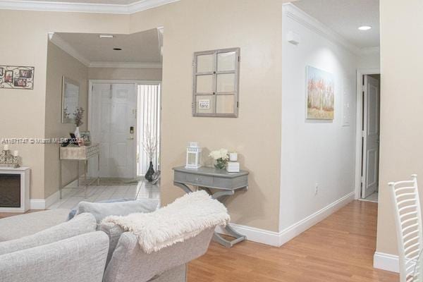 bathroom with wood-type flooring and ornamental molding