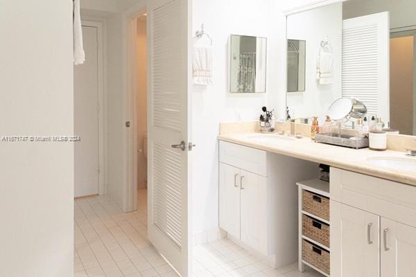 bathroom featuring vanity and tile patterned flooring