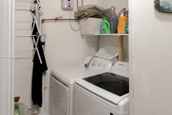 laundry room with washing machine and dryer