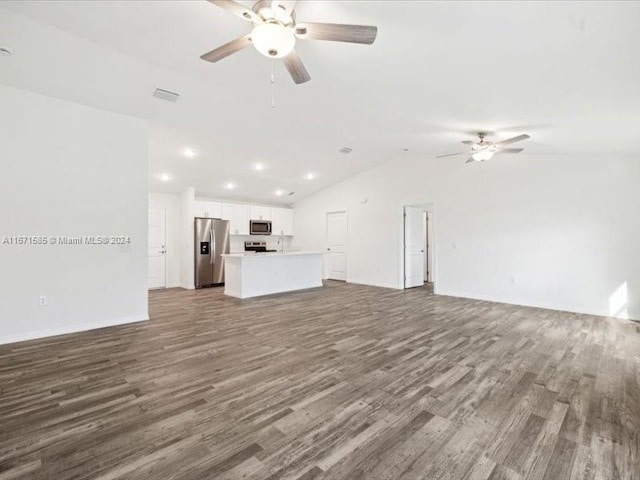 unfurnished living room with lofted ceiling, hardwood / wood-style floors, and ceiling fan