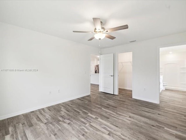 spare room featuring ceiling fan and wood-type flooring