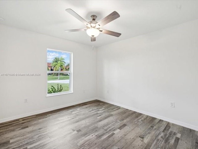 unfurnished room with hardwood / wood-style floors and ceiling fan