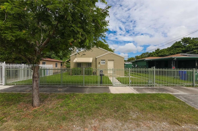 bungalow-style house featuring a front yard