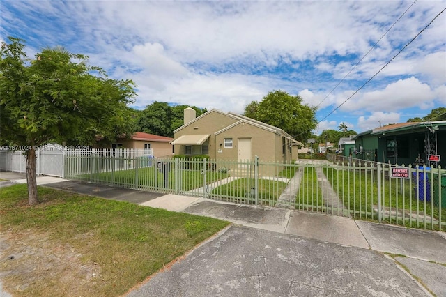 bungalow with a front lawn