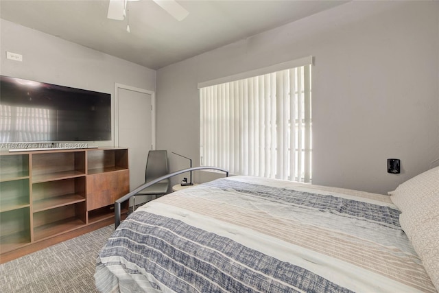 bedroom with wood-type flooring and ceiling fan