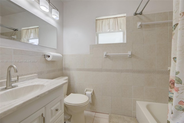 full bathroom with tile walls, shower / bathtub combination with curtain, vanity, tile patterned flooring, and toilet