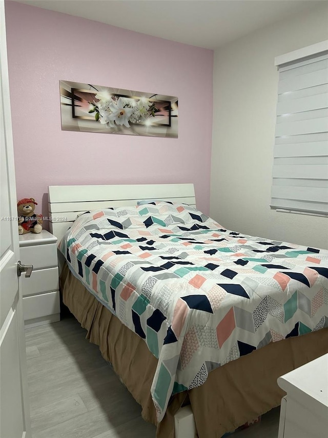 bedroom featuring light wood-type flooring