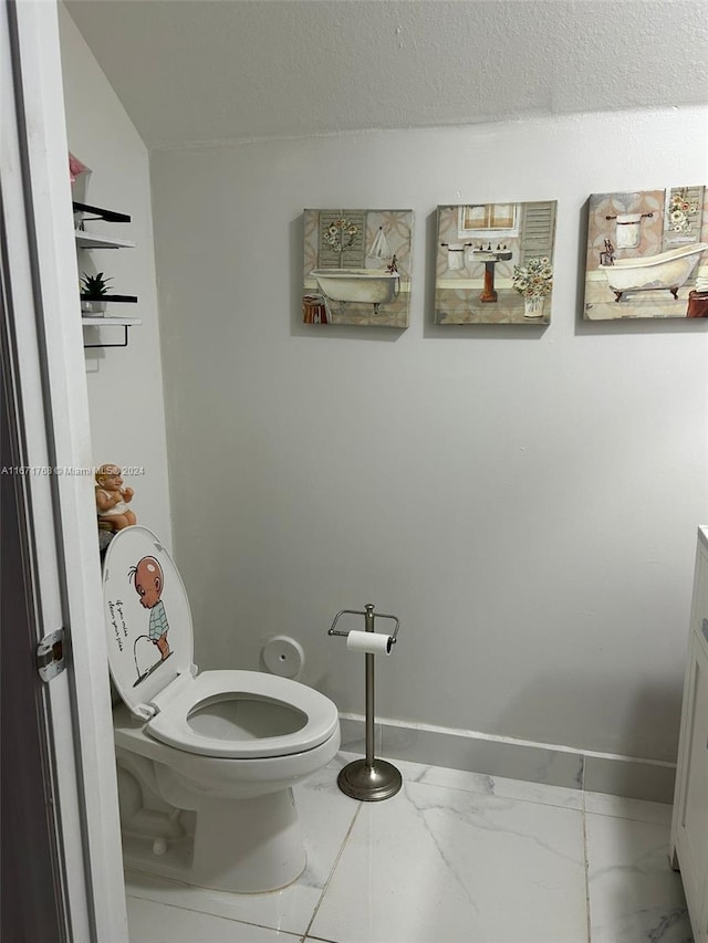 bathroom featuring toilet