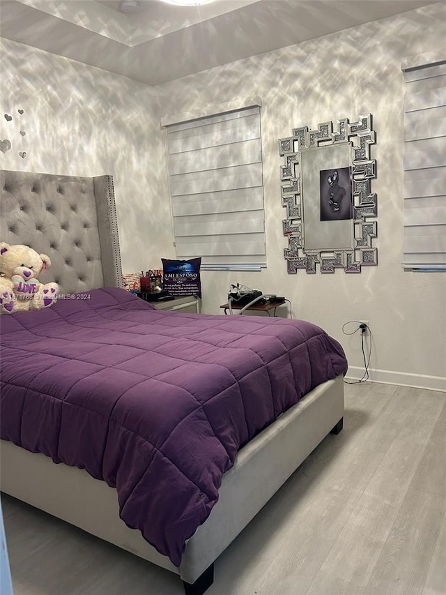 bedroom featuring hardwood / wood-style flooring