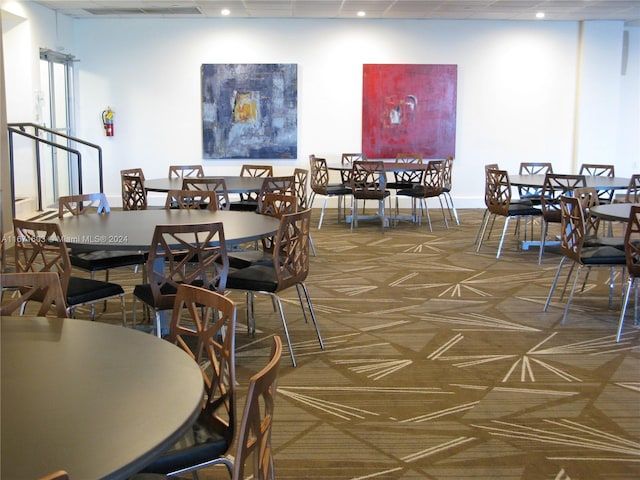 dining room with dark carpet