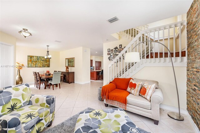 1892 SW 148th Way, Miramar, FL 33027 - living room with light tile patterned floors, stairs, and a chandelier