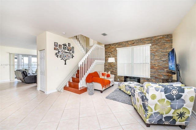 living room featuring french doors, stairway, light tile patterned flooring, and baseboards