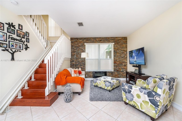 living room with stairs and tile patterned floors