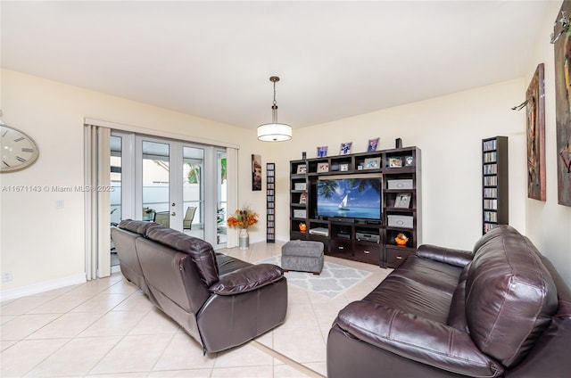 living room with light tile patterned floors and baseboards