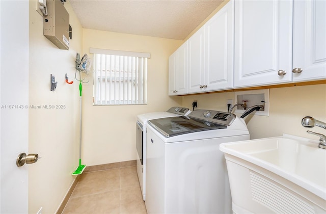1892 SW 148th Way, Miramar, FL 33027 - laundry room with independent washer and dryer, cabinet space, light tile patterned flooring, and a textured ceiling