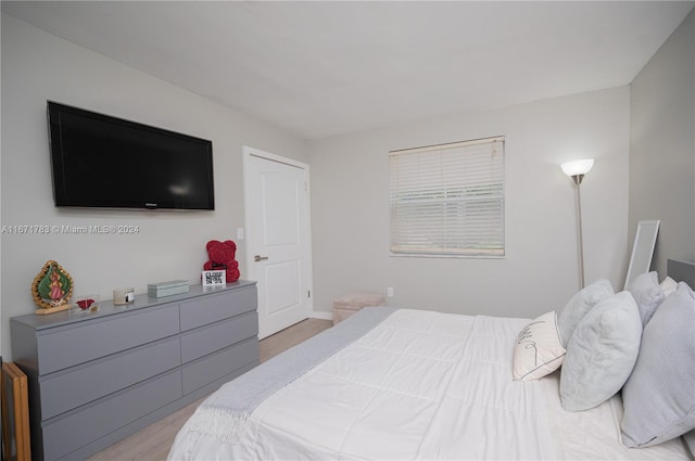 bedroom with light hardwood / wood-style flooring