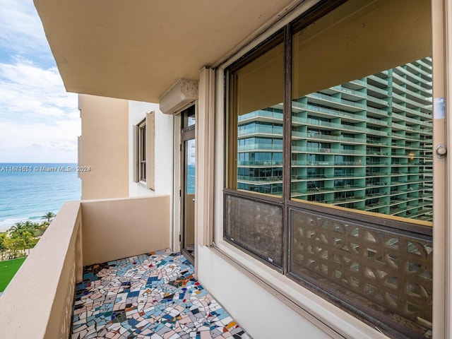 balcony featuring a water view