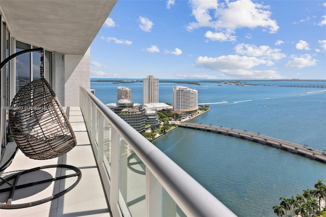 balcony featuring a water view