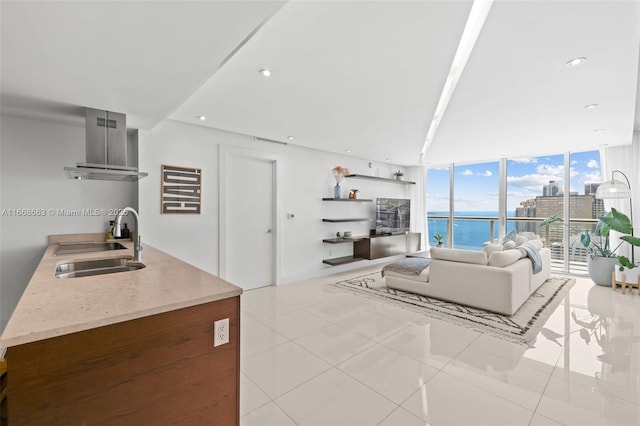 living area featuring expansive windows, tile patterned flooring, and recessed lighting