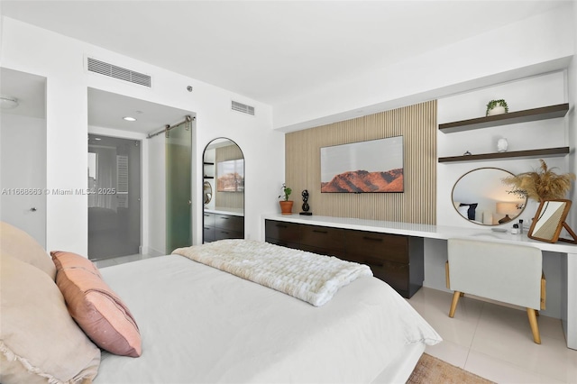 bedroom with light tile patterned floors and visible vents