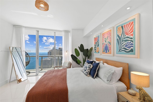 bedroom featuring recessed lighting, a water view, access to exterior, tile patterned floors, and expansive windows