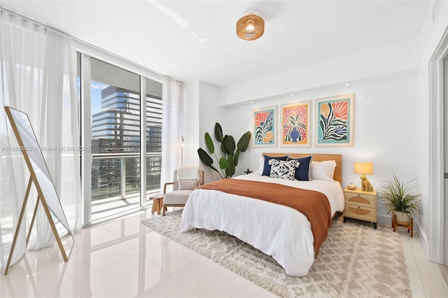 bedroom with access to outside, floor to ceiling windows, baseboards, and light tile patterned floors