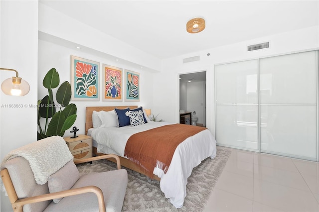 bedroom featuring visible vents and tile patterned floors