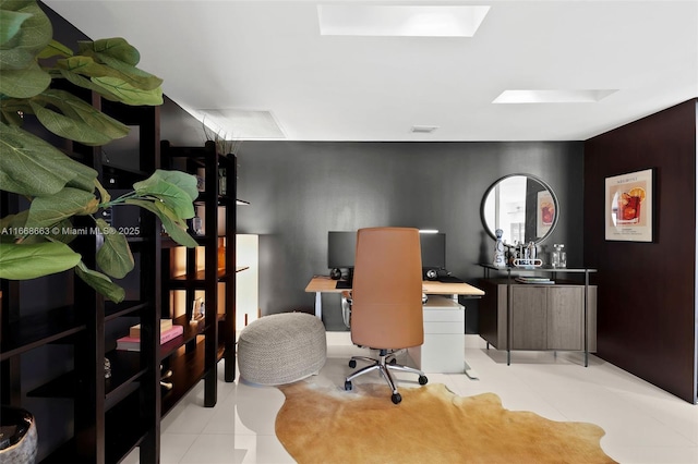 office area featuring a skylight and visible vents