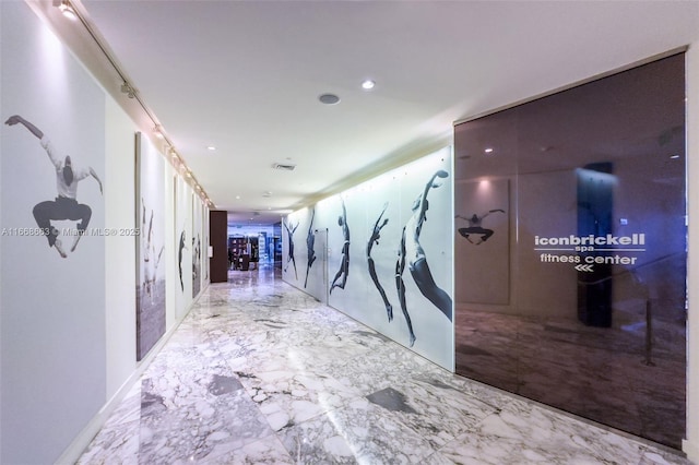 hall featuring marble finish floor, visible vents, and recessed lighting