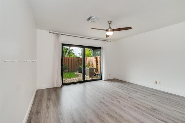 unfurnished room with light wood-type flooring and ceiling fan