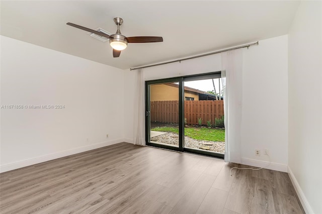 unfurnished room with light hardwood / wood-style floors and ceiling fan