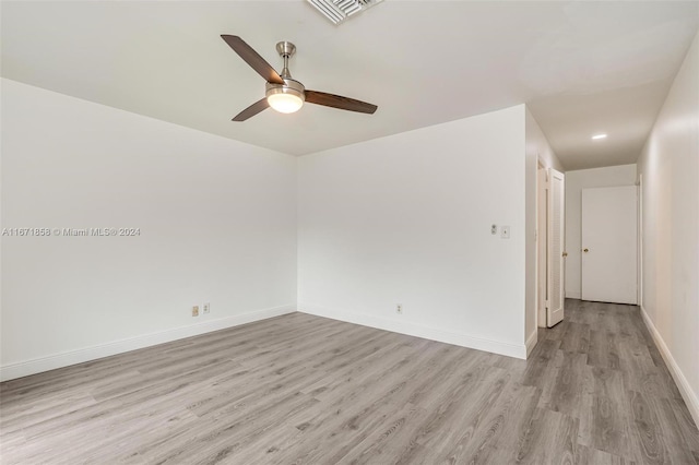 unfurnished room with light wood-type flooring and ceiling fan