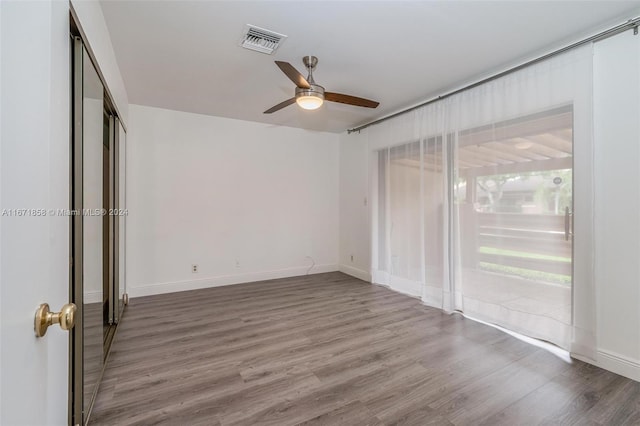 spare room featuring ceiling fan and hardwood / wood-style flooring